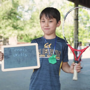 Kid with tennis racket. Having Fun after school